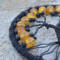 close up details of 8mm orange crackle glass beads adorn black wire tree of life